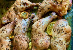 Roast chicken legs with thyme, oregano, garlic and lemon