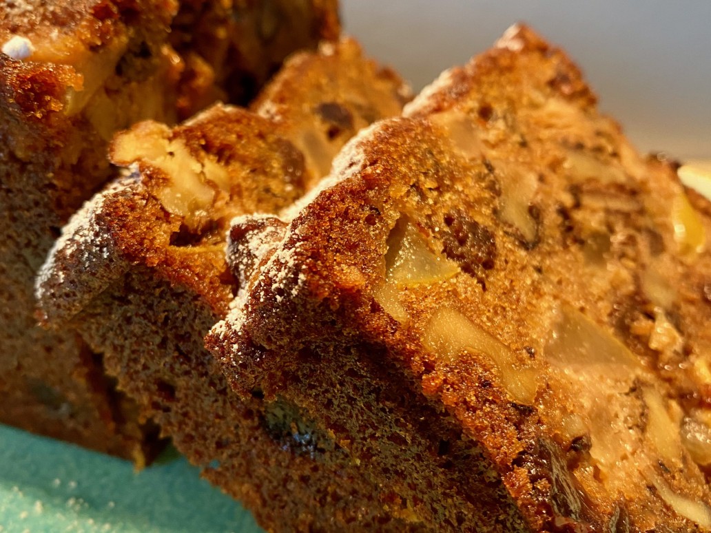 a slice of cake with pear rum and raisin